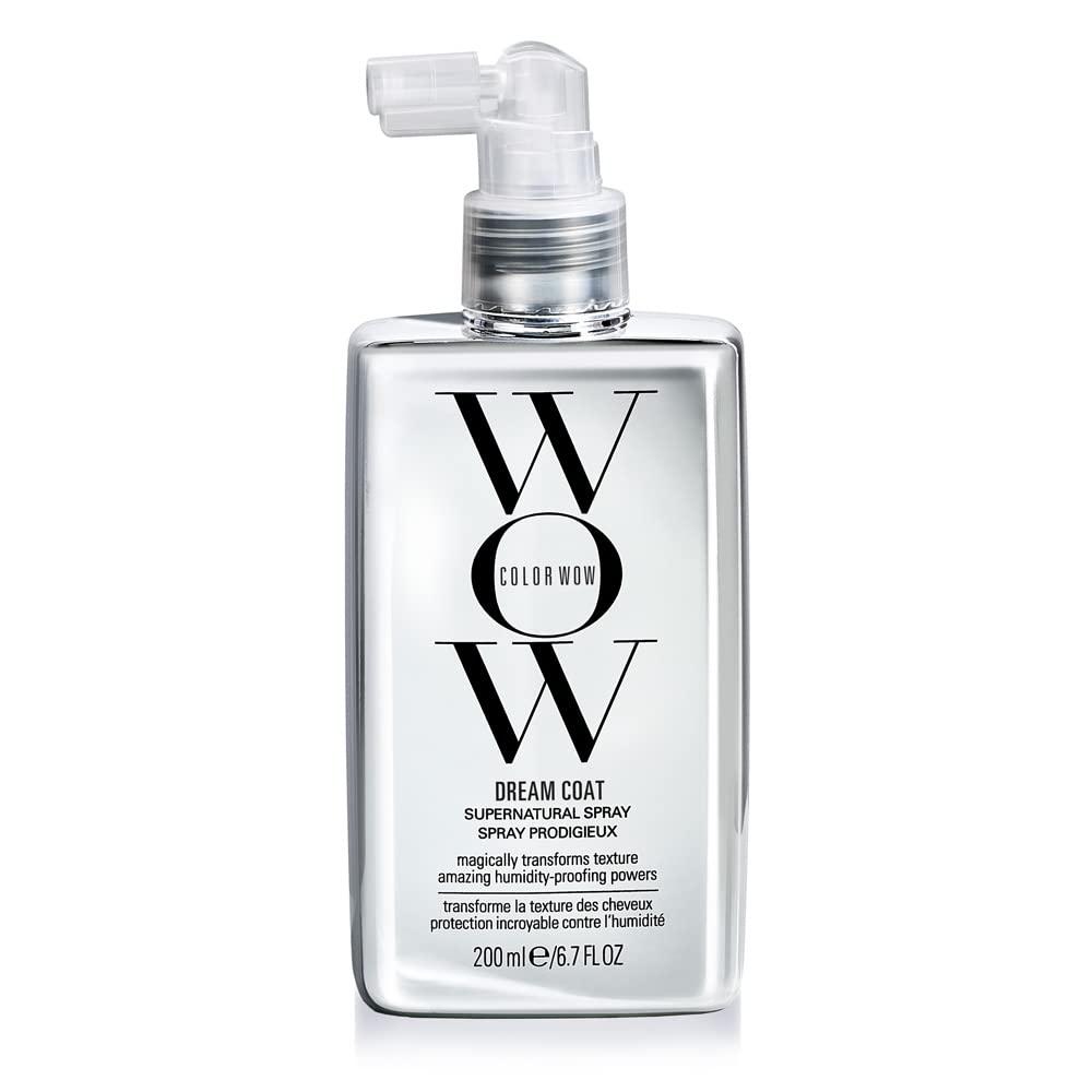 A tall, slender spray bottle of Color Wow Dream Coat Anti-Humidity Treatment with a black cap and silver-toned label on a white background